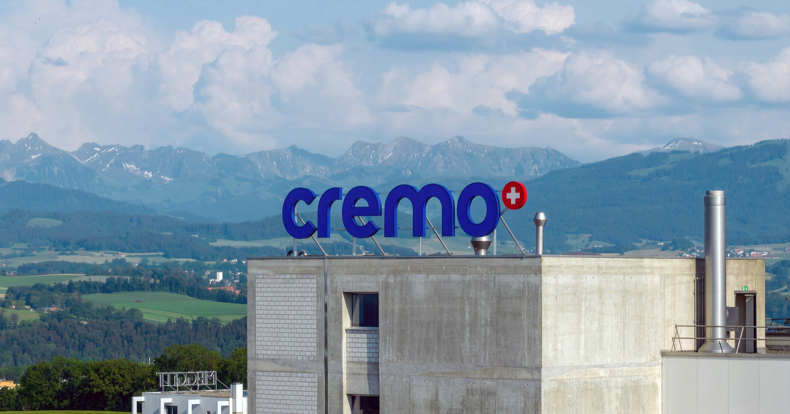 creamery with town and mountains in background
