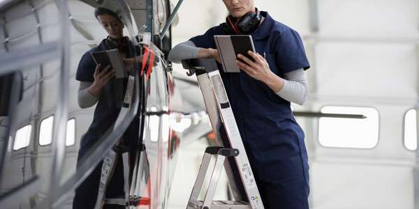 Aerospace and defense engineer inspecting a device 