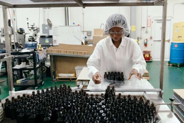 factory worker bottling at a plant
