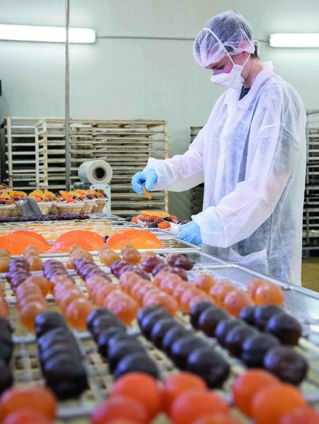 male worker safety gear PPE food assembly line