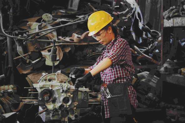 woman automotive factory worker engine