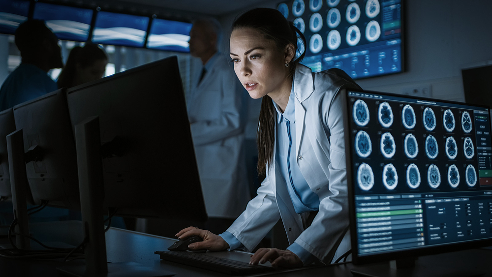 Female Scientist Neurologist Working on a Personal Computer in Modern Laboratory