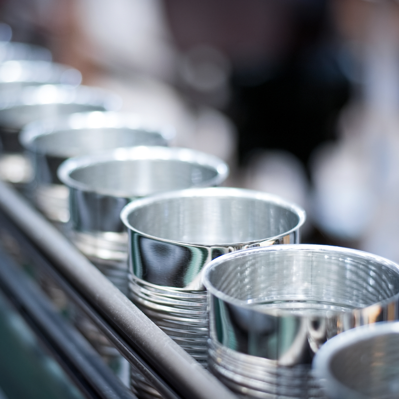 Empty cans running on automatic conveyor belt