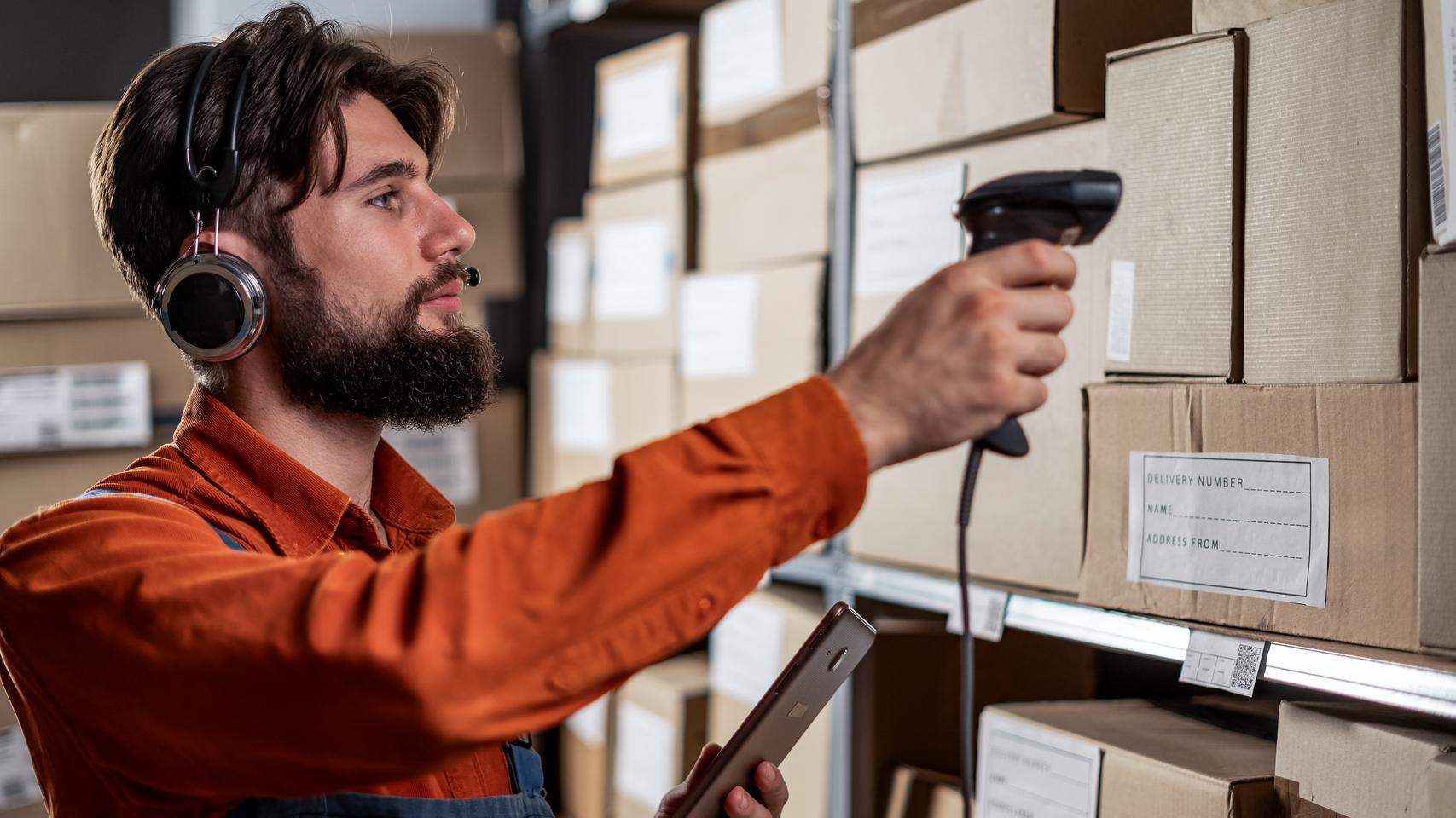 Warehouse worker scanning a box