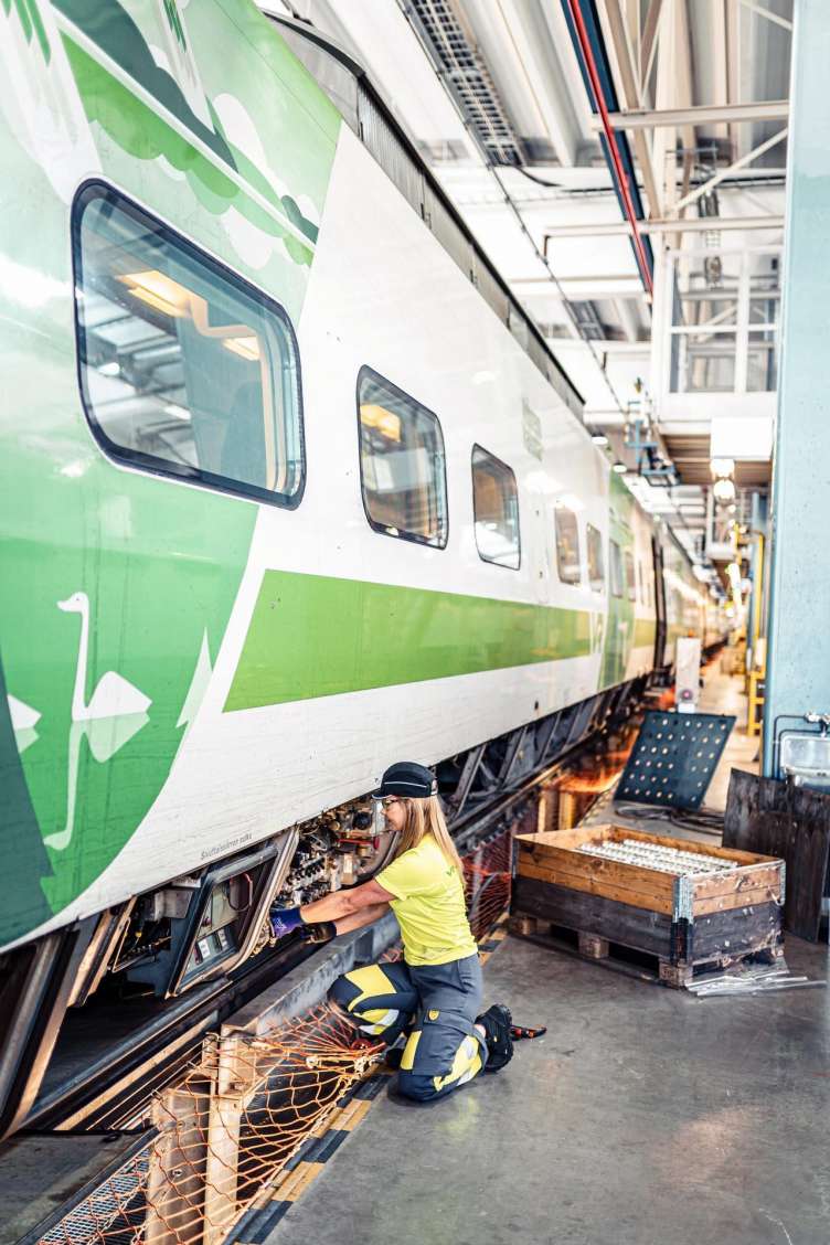 Woman repairing a train