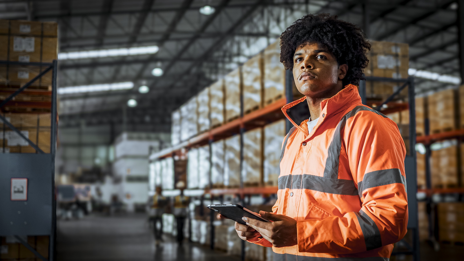 1488290232 Young African
  American black man warehouse worker checks stock GETTY Edited tif