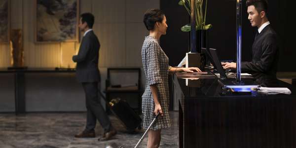  elegant woman checking   into hotel HOSP China APAC     