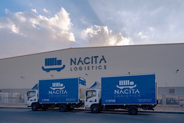 2 Nacita delivery trucks outside warehouse