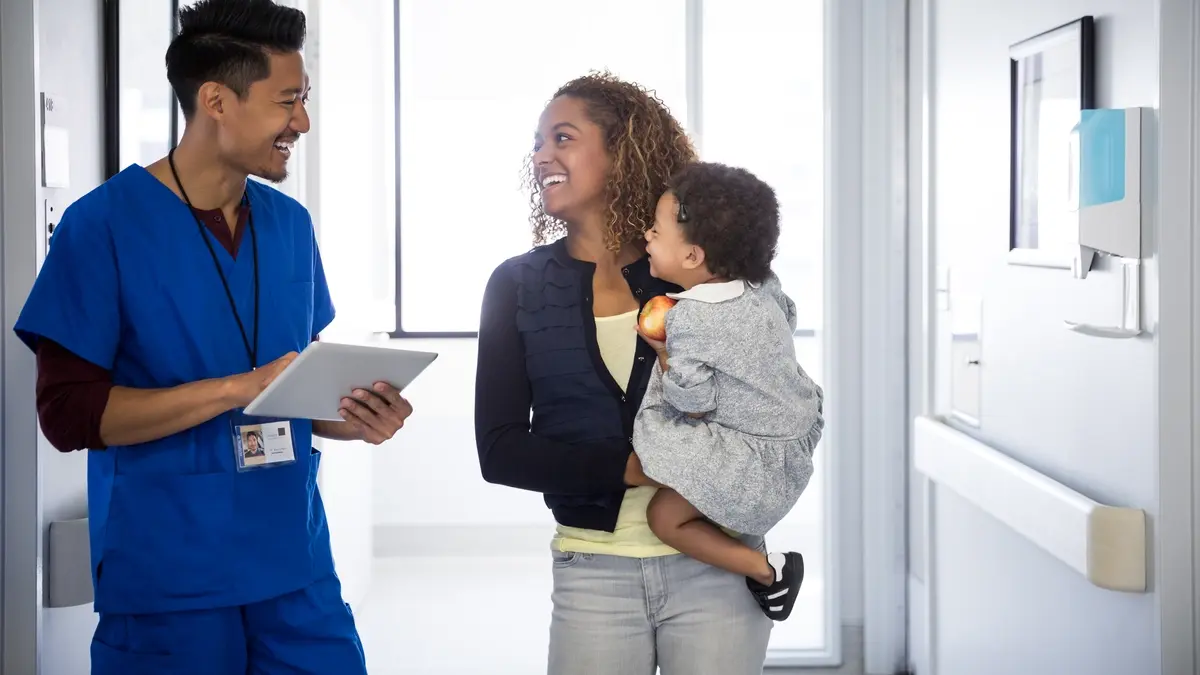 Doctor and patients in hallway
