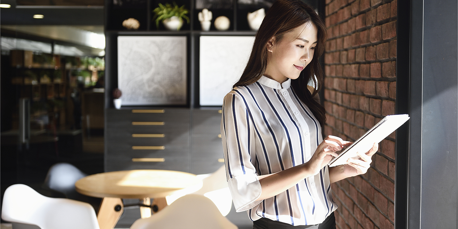 1148948686   Chinese business woman using tablet office PortraitIso General Getty 1600x800