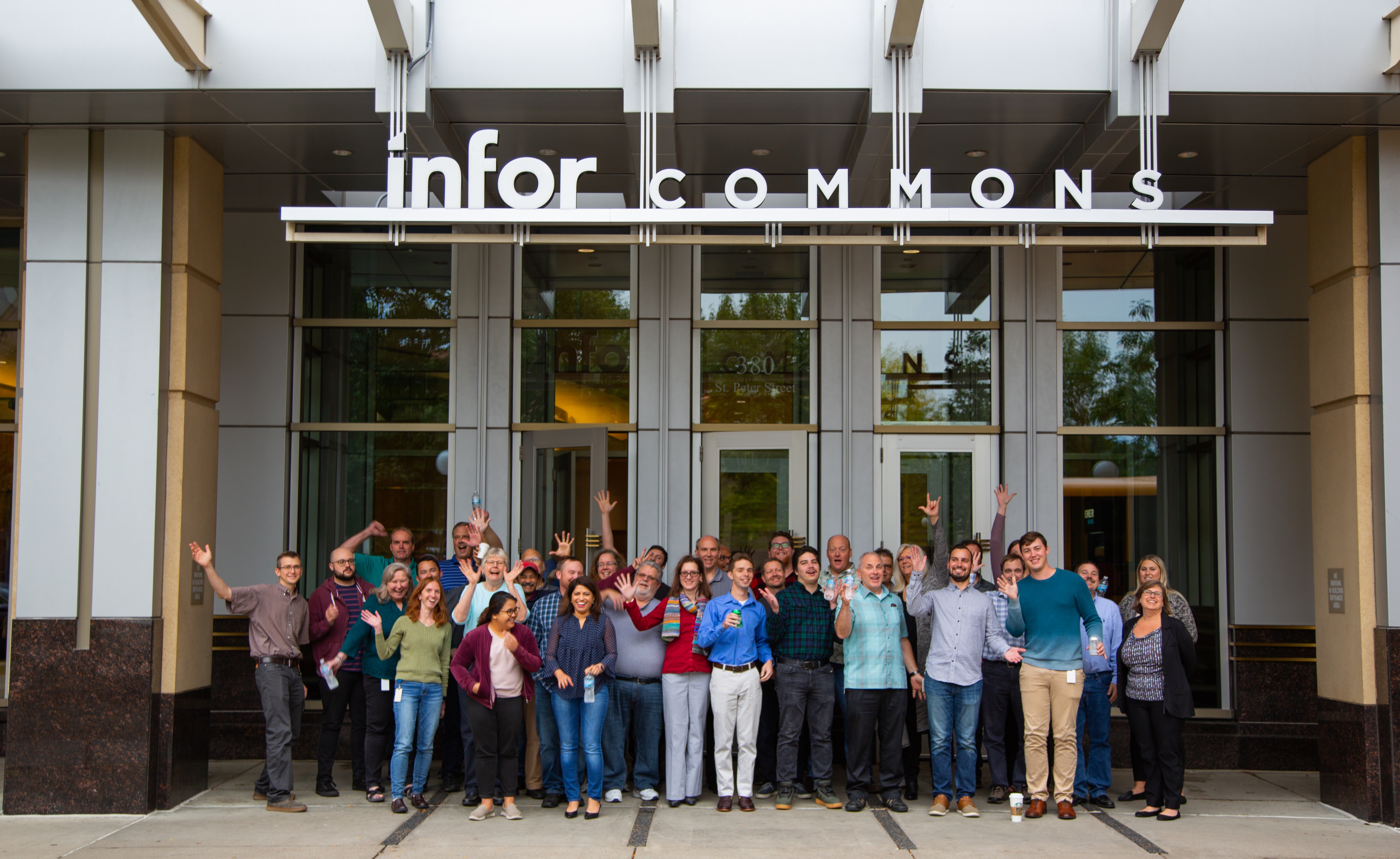 Employees in front of Infor office building in St. Paul Minnesota