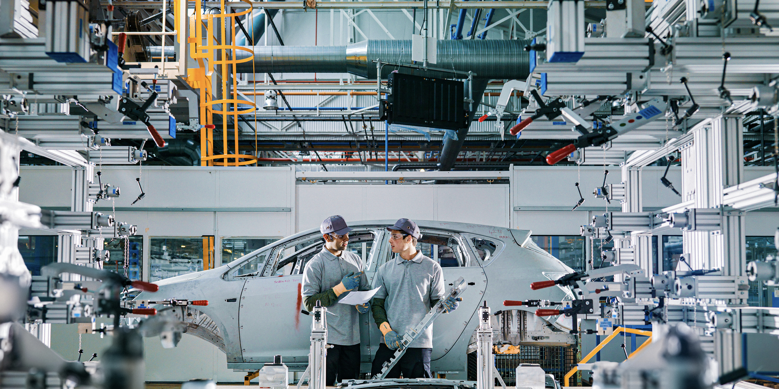 Car Plant Workers On Production Line