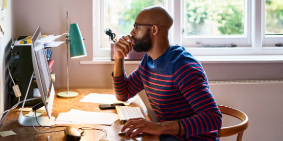 man sitting at a desk