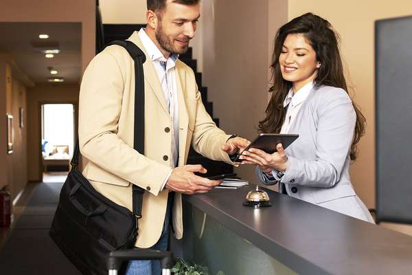 Man checking into a hotel