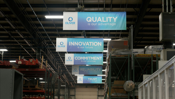 motivational signs hanging in factory