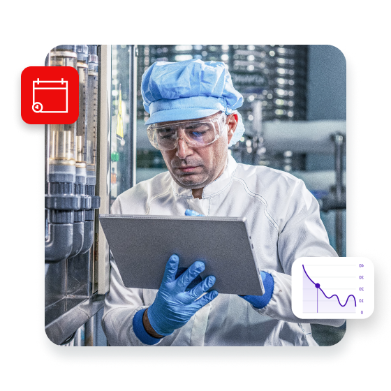 Male worker using digital tablet checking quality drinking water management system before process of filling water into bottles to bring out to consumers