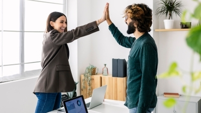 Infor employees high-fiving 