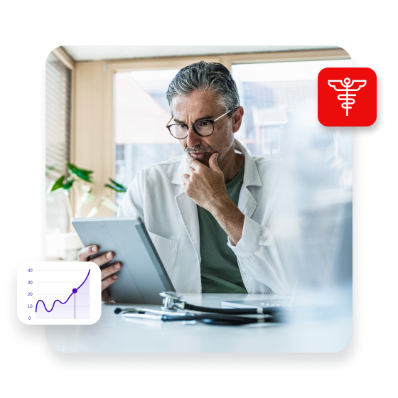 Man in lab coat using tablet PC in clinic