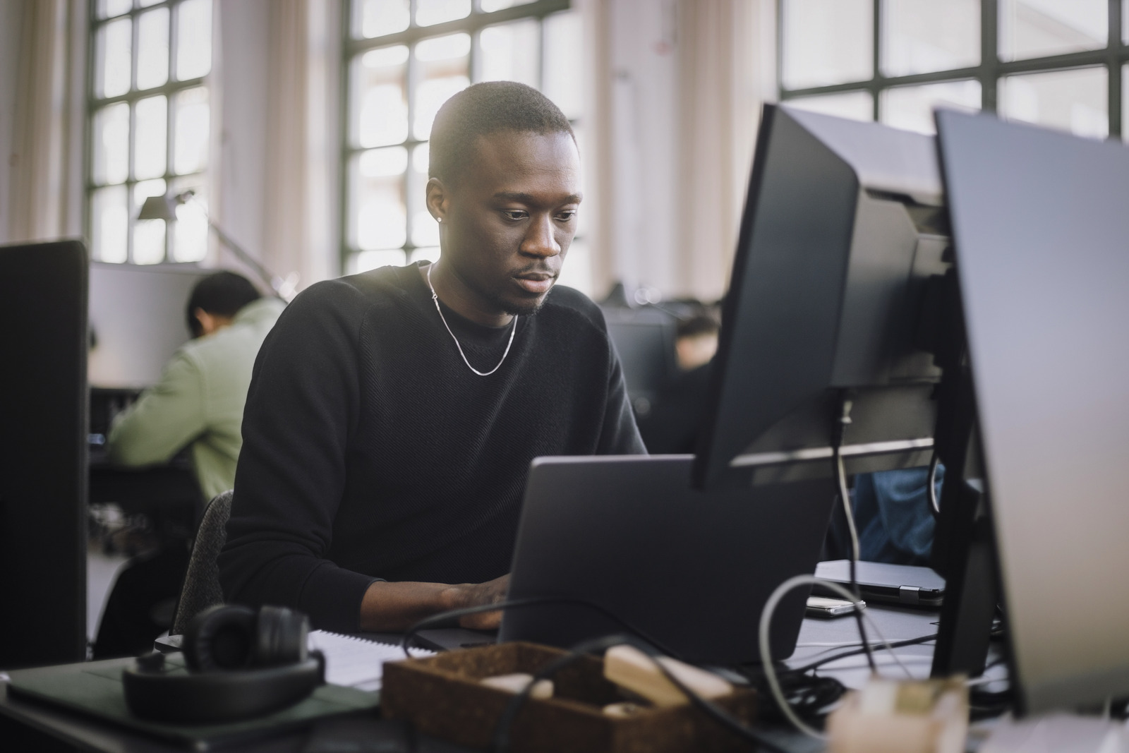 Employee using the Infor Digital Change tool on a desktop computer