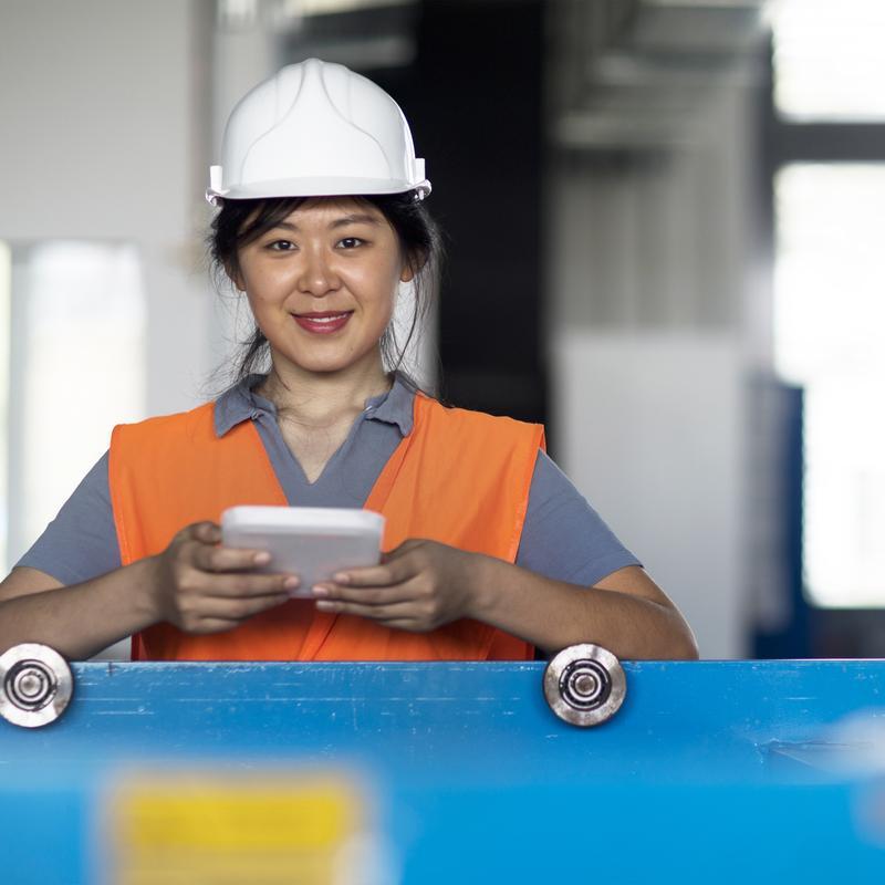 female technician factory tablet hardhat APAC 