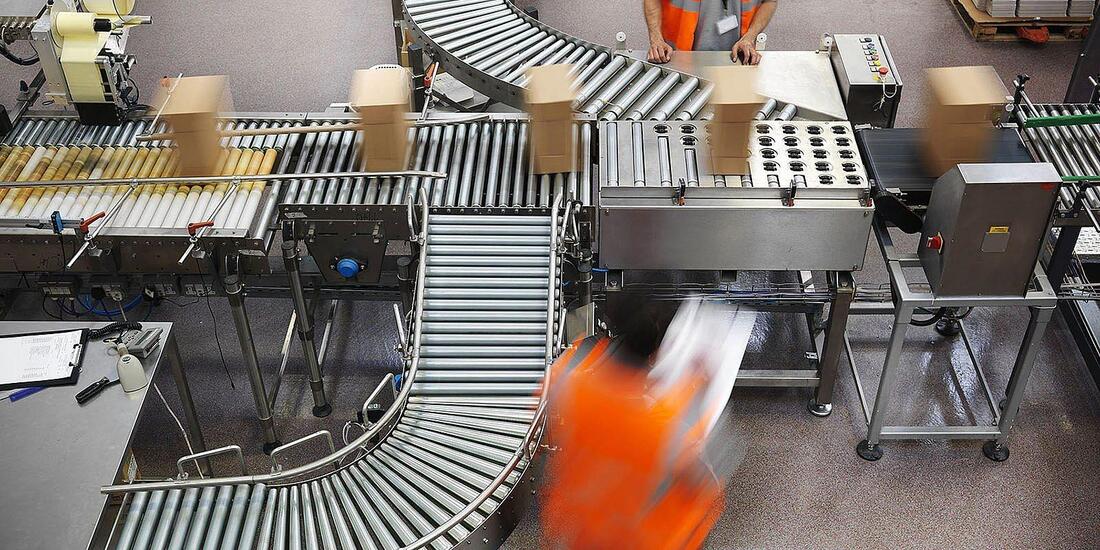 factory workers in a bottling plant production