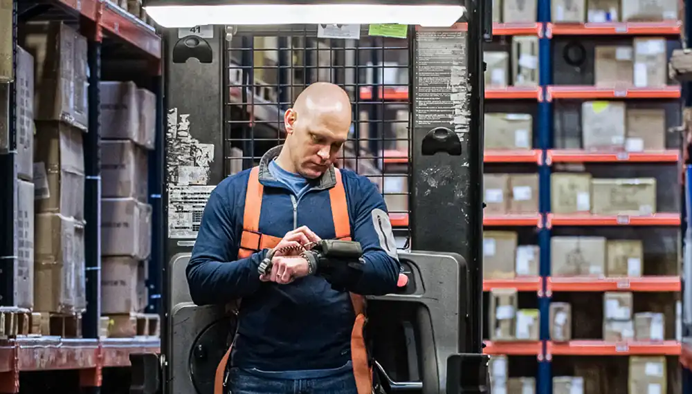 Forklift operator in a warehouse 