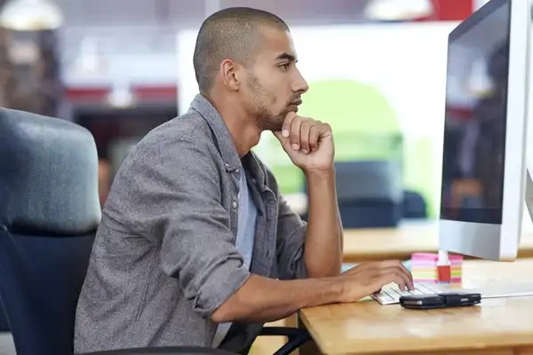 Employee working at a computer in an office