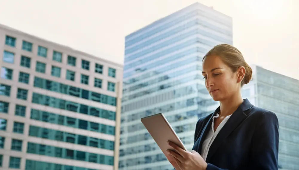 Businesswoman using cloud ERP on a tablet 