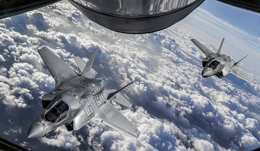 Two jets conducting a midair refueling