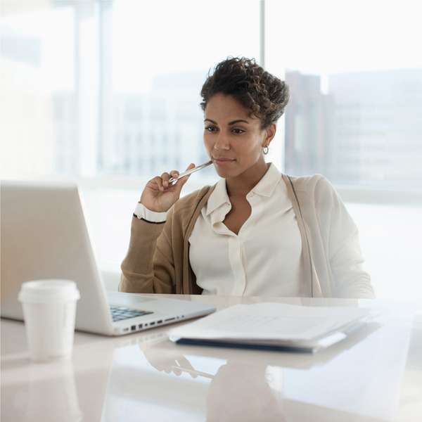 Woman using event management software on a laptop