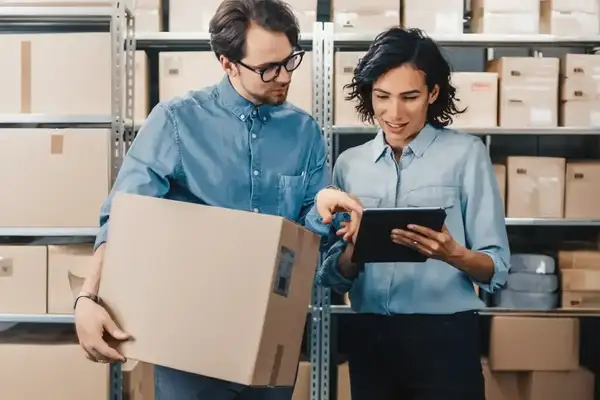 Crocs employees using P2P automation software on a tablet