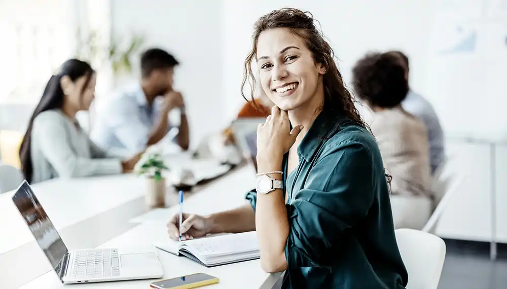 emale-Employee-Smiling-Office-Dayinlife-General