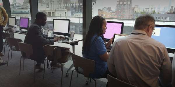 people looking at computers