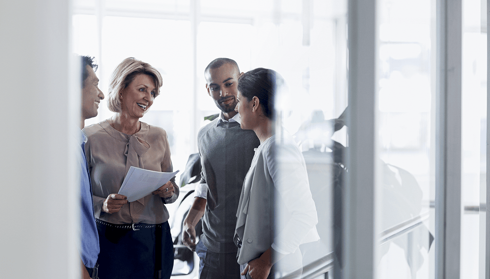 A team meeting in a glass office