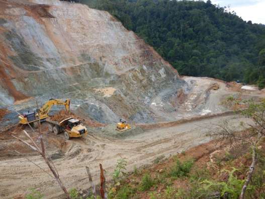 Excavator and truck in mine