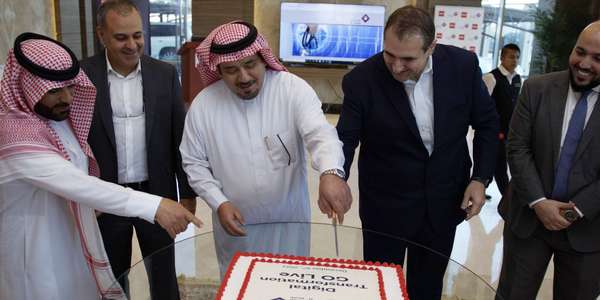 Al-Khaldi men cutting cake Saudi celebration