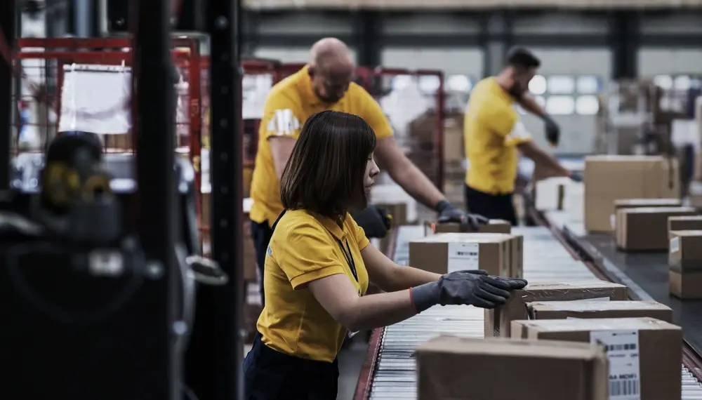 Woman scanning and checking boxes