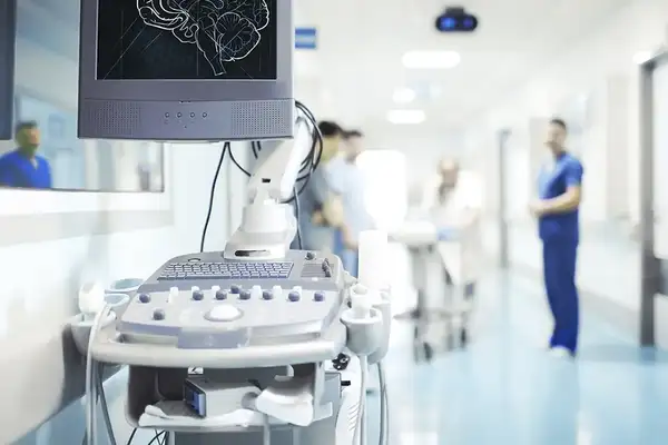Hospital hallway with healthcare professionals and medical supplies