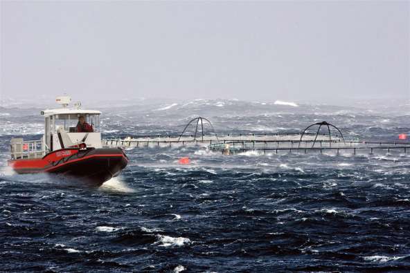 photo of a boat in stormy Norway waters