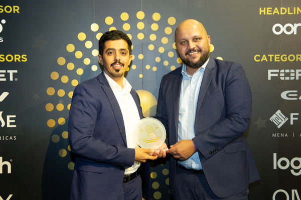 NEFC Group’s logistics manager Salah Alamoudi, left, and CIO Eiad Abushaireh accept the Enterprise: Intelligent Construction Implementation Award