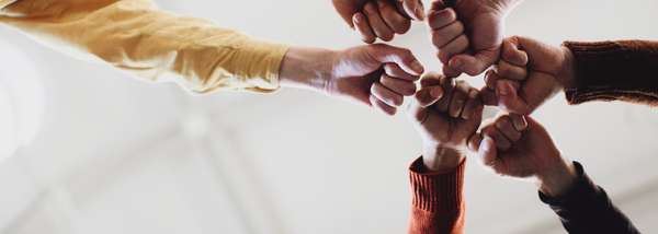 circle of hands joining together