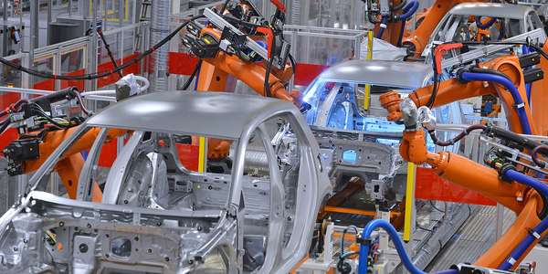 robots welding in factoryBkgrd mono 