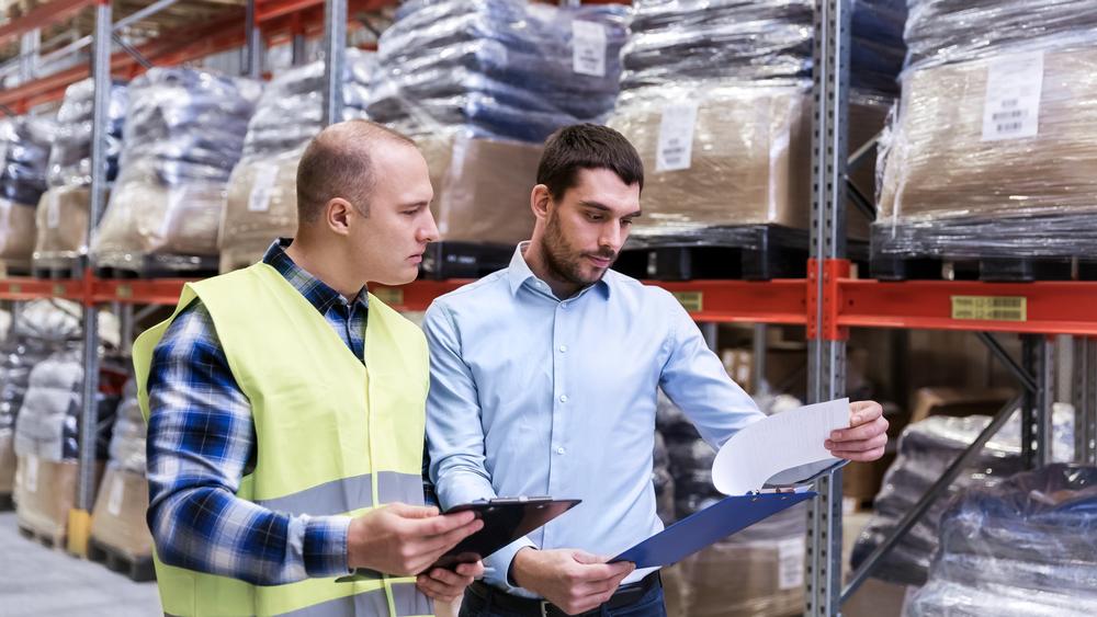 Warehouse workers checking inventory