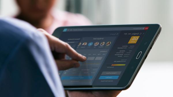 Person using healthcare software solution on tablet