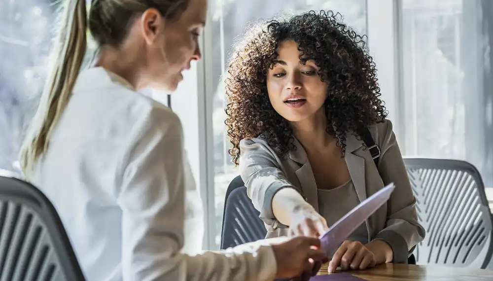 Two women talking in an office