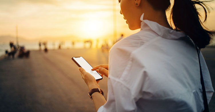 Woman mobile phone outside sunshine