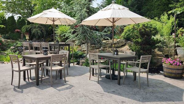 tables chairs umbrellas on patio