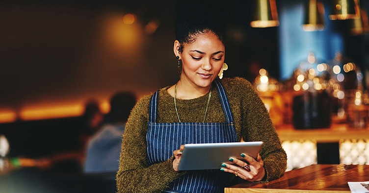 hospitality worker with tablet