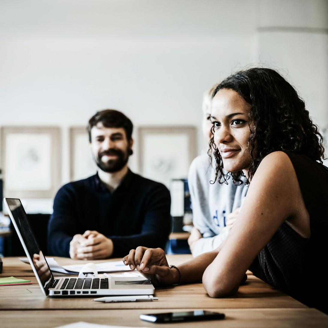 business people meeting sitting on a big conference table