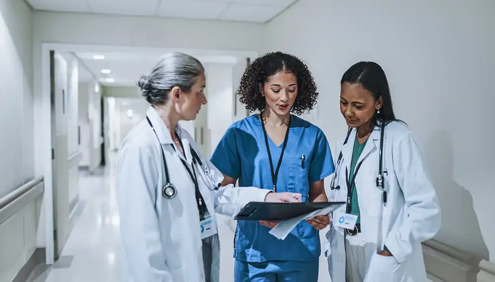 Doctors and nurses collaborating on a patient chart